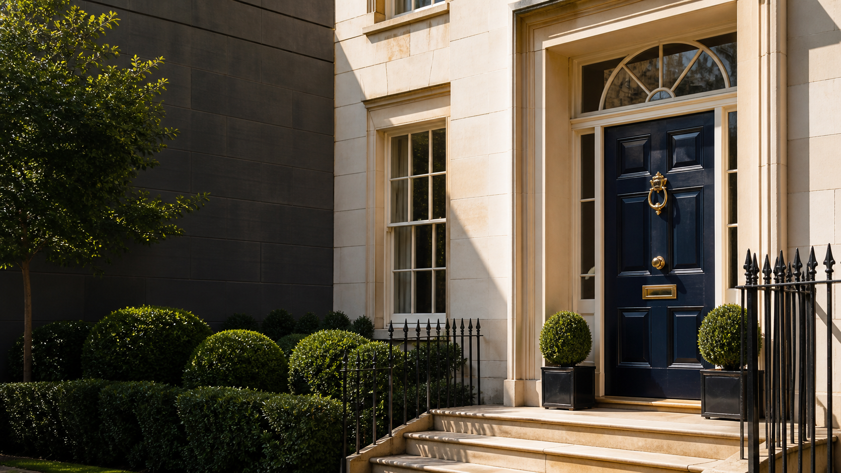 Elegant British townhouse with a midnight navy front door